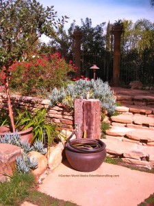 Planter used as water hose storage