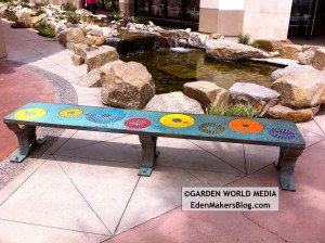 Custom mosaic tile bench in garden