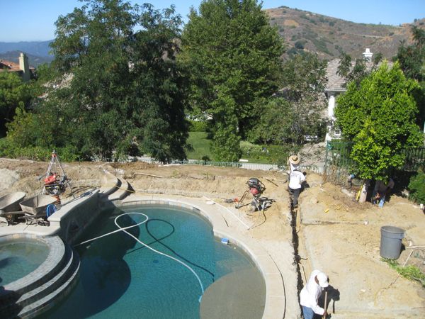 trenching for pipes during pool makeover